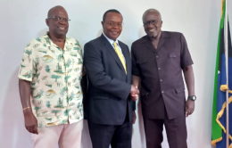 Governor Otuoma shakes hands with Dennis Awori.